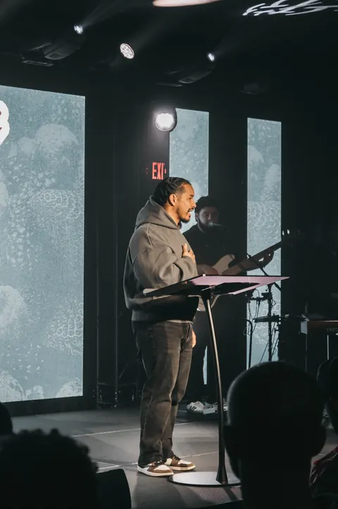 A speaker, stage lighting, and video displays at Radiant Church’s Clearwater location.