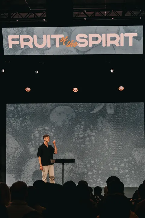 A view from the congregation toward the stage and large video displays at Radiant Church’s South Tampa location.