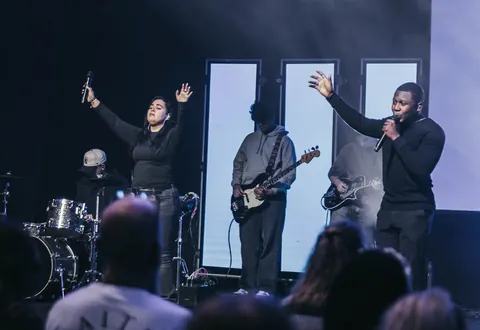 The worship team, drums, and stage backdrop at Radiant Church’s Westchase location.